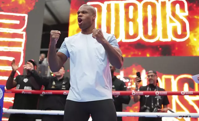 Britain's Daniel Dubois warms up during a public workout at BoxPark near Wembley stadium in London, Wednesday, July 16, 2025 ahead of the undisputed heavyweight champion boxing fight between Britain's Daniel Dubois and Ukraine's boxer Oleksandr Usyk on Saturday. (AP Photo/Kirsty Wigglesworth)