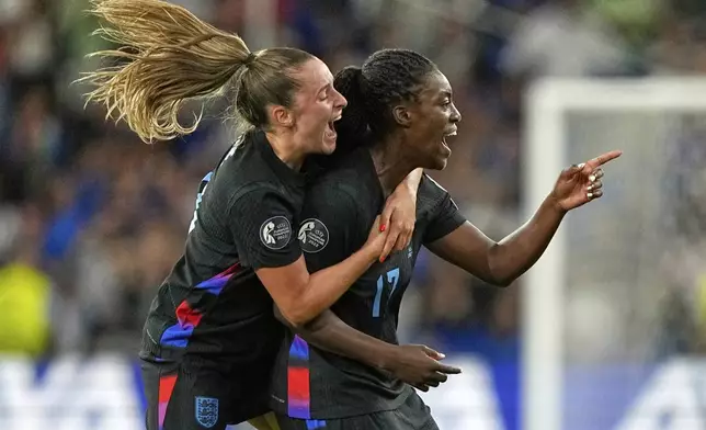 England's Michelle Agyemang, right, celebrates with Ella Toone after scoring her side's first goal during the Women's Euro 2025 semifinals soccer match between England and Italy at Stade de Geneve in Geneva, Switzerland, Tuesday, July 22, 2025. (AP Photo/Martin Meissner)