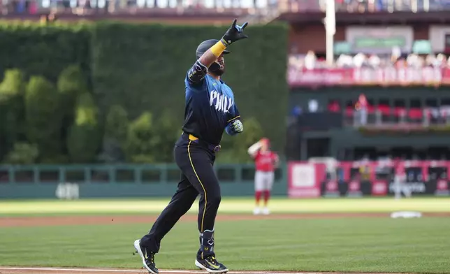 Philadelphia Phillies' Kyle Schwarber reacts after hitting a home run against Los Angeles Angels pitcher Ryan Zeferjahn during the first inning of a baseball game Friday, July 18, 2025, in Philadelphia. (AP Photo/Matt Slocum)