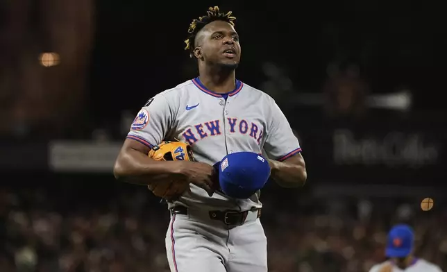 New York Mets' Huascar Brazobán walks to the dugout after pitching against the San Francisco Giants in the sixth inning of a baseball game Friday, July 25, 2025, in San Francisco. (AP Photo/Godofredo A. Vásquez)