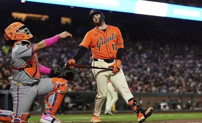 San Francisco Giants' Casey Schmitt (10) reacts after striking out during the sixth inning of a baseball game against the New York Mets, Friday, July 25, 2025, in San Francisco. (AP Photo/Godofredo A. Vásquez)