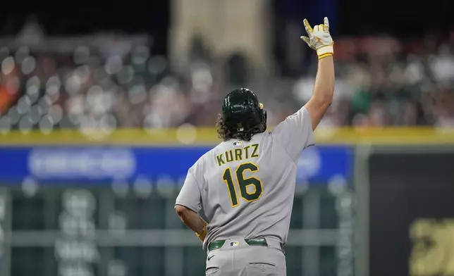 Athletics' Nick Kurtz celebrates after hitting a home run against the Houston Astros during the eighth inning of a baseball game Friday, July 25, 2025, in Houston. (AP Photo/David J. Phillip)