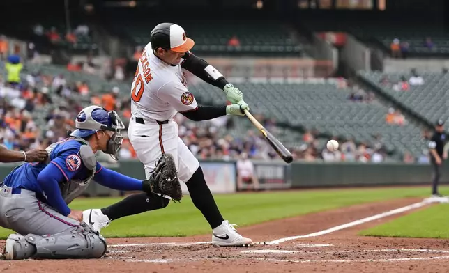 Baltimore Orioles' Alex Jackson (70) hits an RBI double to score Cedric Mullins during the second inning in the second baseball game of a doubleheader against the New York Mets, Thursday, July 10, 2025, in Baltimore. (AP Photo/Stephanie Scarbrough)
