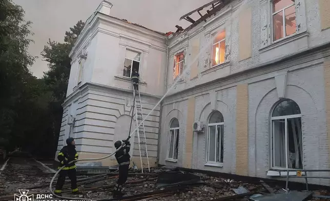 In this photo provided by the Ukrainian Emergency Service, firefighters put out the fire in a fire department school following a Russian air attack in Kropyvnytskyi, Ukraine, Monday, July 28, 2025. (Ukrainian Emergency Service via AP)