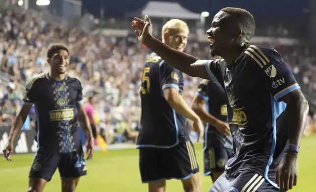 Philadelphia Union's Olwethu Makhanya, right, celebrates after scoring a goal during the second half of an MLS soccer match against the CF Montréal, Wednesday, July 16, 2025, in Chester, Pa. (AP Photo/Matt Slocum)