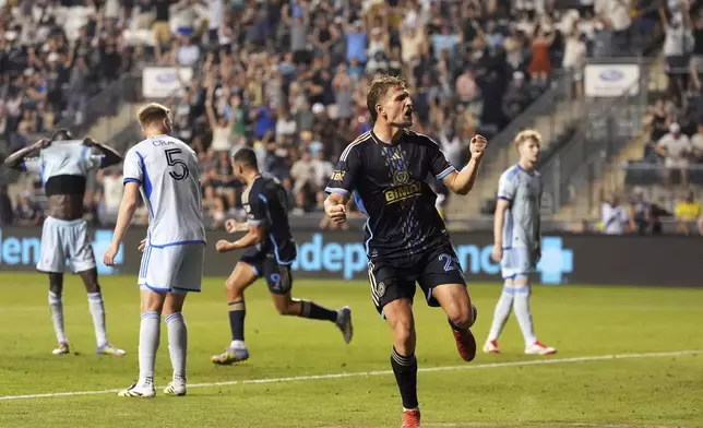 Philadelphia Union's Bruno Damiani, right, celebrates after a goal by Olwethu Makhanya during the second half of an MLS soccer match against the CF Montréal, Wednesday, July 16, 2025, in Chester, Pa. (AP Photo/Matt Slocum)