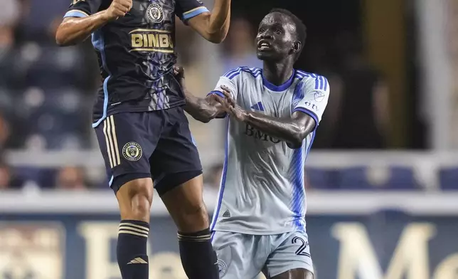 Philadelphia Union's Cavan Sullivan, left, leaps for the ball against CF Montréal's Victor Loturi during the second half of an MLS soccer match, Wednesday, July 16, 2025, in Chester, Pa. (AP Photo/Matt Slocum)