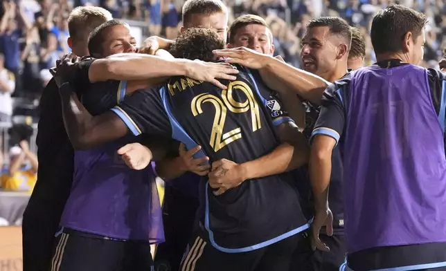 Philadelphia Union's Olwethu Makhanya celebrates with teammates after scoring a goal during the second half of an MLS soccer match against the CF Montréal, Wednesday, July 16, 2025, in Chester, Pa. (AP Photo/Matt Slocum)