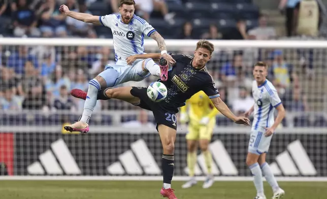 CORRECTS PLAYER'S NAME TO JOEL WATERMAN NOT TYRESE SPICER AND TEAM TO CF MONTREAL NOT TORONTO FC - CF Montreal's Joel Waterman, left, and Philadelphia Union's Bruno Damiani collide during the first half of an MLS soccer match, Wednesday, July 16, 2025, in Chester, Pa. (AP Photo/Matt Slocum)