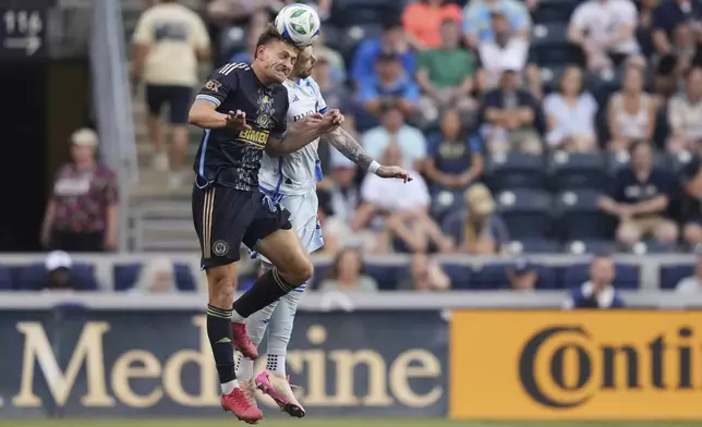 CORRECTS PLAYER'S NAME TO JOEL WATERMAN NOT TYRESE SPICER AND TEAM TO CF MONTREAL NOT TORONTO FC - Philadelphia Union's Bruno Damiani, left, and CF Montreal's Joel Waterman leap for the ball during the first half of an MLS soccer match, Wednesday, July 16, 2025, in Chester, Pa. (AP Photo/Matt Slocum)