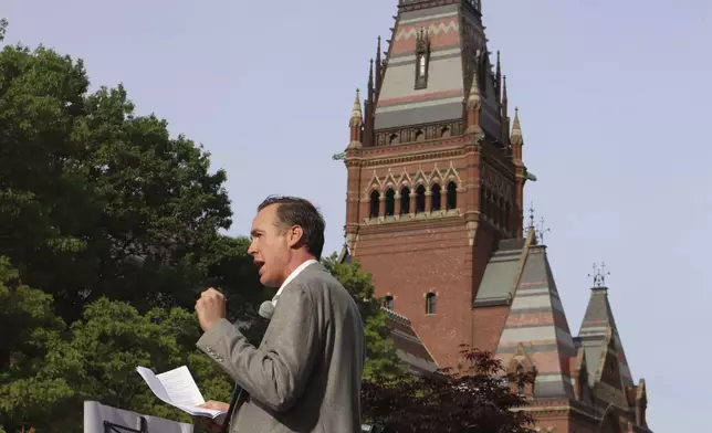 FILE - Ryan Enos, a government professor at Harvard University, speaks at a protest against President Donald Trump's recent sanctions against Harvard in front of Science Center Plaza on May 27, 2025, in Cambridge, Mass. (AP Photo/Leah Willingham, File)