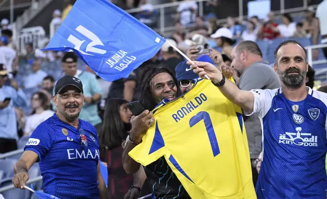 Fans cheer before the Club World Cup round of 16 soccer match between Manchester City and Al Hilal in Orlando, Fla., Monday, June 30, 2025. (AP Photo/Phelan Ebenhack)