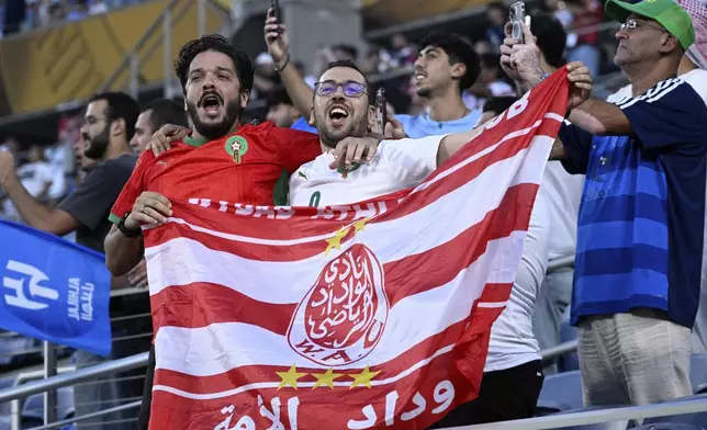 Fans cheer before the Club World Cup round of 16 soccer match between Manchester City and Al Hilal in Orlando, Fla., Monday, June 30, 2025. (AP Photo/Phelan Ebenhack)