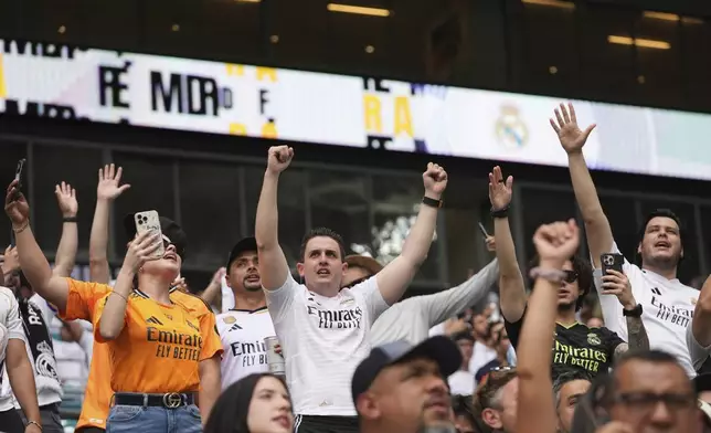Real Madrid fans cheer their team before the Club World Cup round of 16 soccer match between Real Madrid and Juventus in Miami Gardens, Fla., Tuesday, July 1, 2025. (AP Photo/Lynne Sladky)