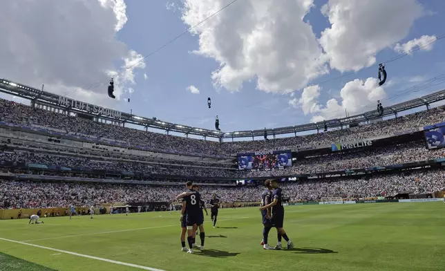 Paris Saint-Germain's Fabian Ruiz celebrates with team mates after scoring his side's third goal during the Club World Cup semifinal soccer match between PSG and Real Madrid in East Rutherford, N.J., Wednesday, July 9, 2025. (AP Photo/Adam Hunger)