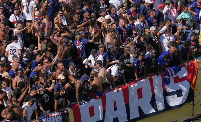 Paris Saint-Germain fans cheer during the Club World Cup semifinal soccer match between PSG and Real Madrid in East Rutherford, N.J., Wednesday, July 9, 2025. (AP Photo/Pamela Smith)