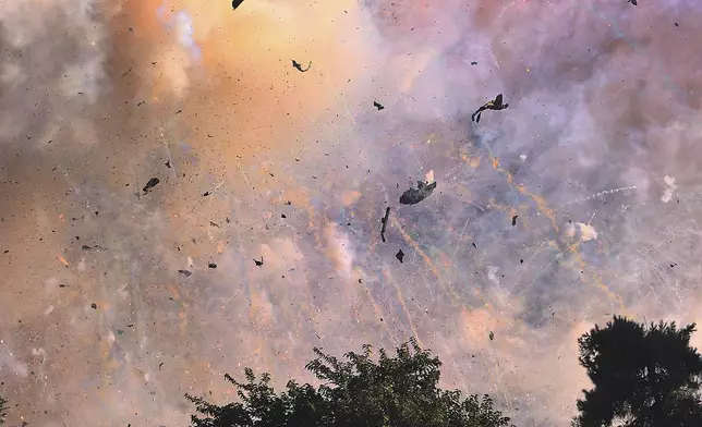 Fireworks explode at a fireworks warehouse near Esparto, Calif., Tuesday, July 1, 2025. (Kent Porter/The Press Democrat via AP)
