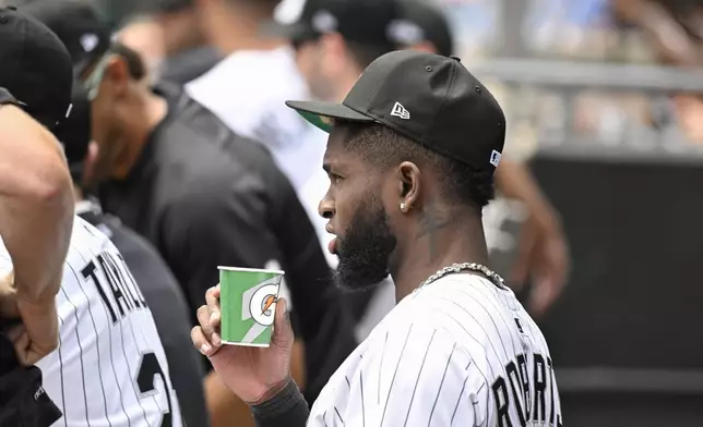 Chicago White Sox outfielder Luis Robert Jr. stands in the dugout during the first inning of a baseball game against the Chicago Cubs, Sunday, July, 27, 2025, in Chicago. (AP Photo/Matt Marton)