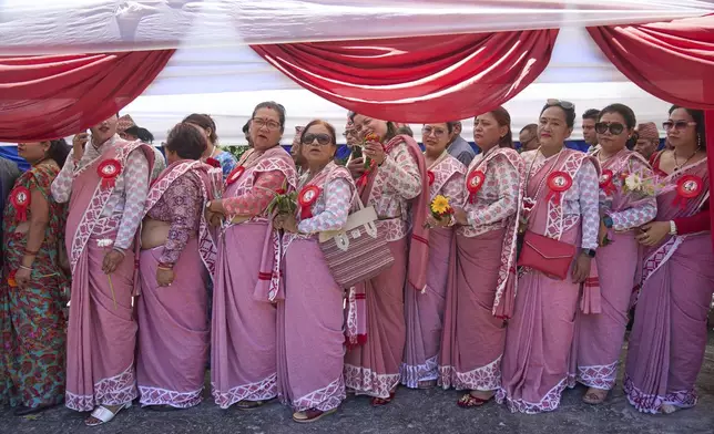 Pro-monarchy supporters line up to offer birthday wishes to former King Gyanendra Shah at his residence in Kathmandu, Nepal, Monday, July 7, 2025. (AP Photo/Niranjan Shrestha)