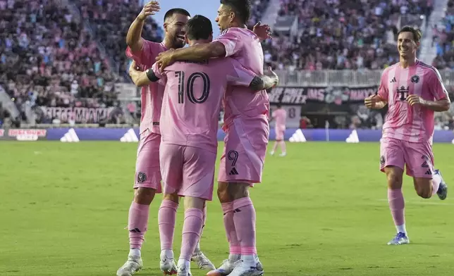 Inter Miami forward Lionel Messi (10) is congratulated after scoring a goal during the first half of an MLS soccer match against Nashville SC, Saturday, July 12, 2025, in Fort Lauderdale, Fla. (AP Photo/Lynne Sladky)