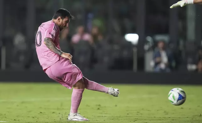 Inter Miami forward Lionel Messi (10) kicks the ball to score a goal during the second half of an MLS soccer match against Nashville SC, Saturday, July 12, 2025, in Fort Lauderdale, Fla. (AP Photo/Lynne Sladky)
