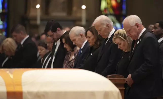 From left, Minnesota attorney general Keith Ellison, Tom Weber, Lt. Gov. Peggy Flanagan, former Minnesota Gov. Mark Dayton, former US Vice President Kamala Harris, former US President Joe Biden, Gwen Walz and Minnesota Gov. Tim Walz attend funeral services for Mark and Melissa Hortman at the Basilica of St. Mary in Minneapolis, Minn., on Saturday, June 28, 2025. (Alex Kormann/Star Tribune via AP, Pool)