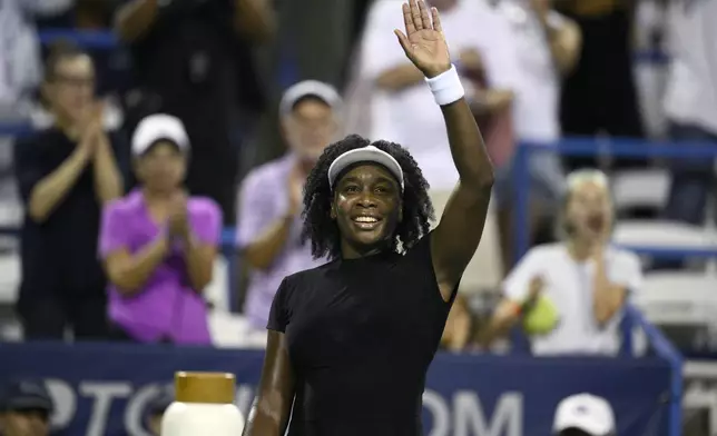 Venus Williams waves to the crowd after she lost to Magdalena Frech, of Poland, during a match at the Citi Open tennis tournament Thursday, July 24, 2025, in Washington. (AP Photo/Nick Wass)