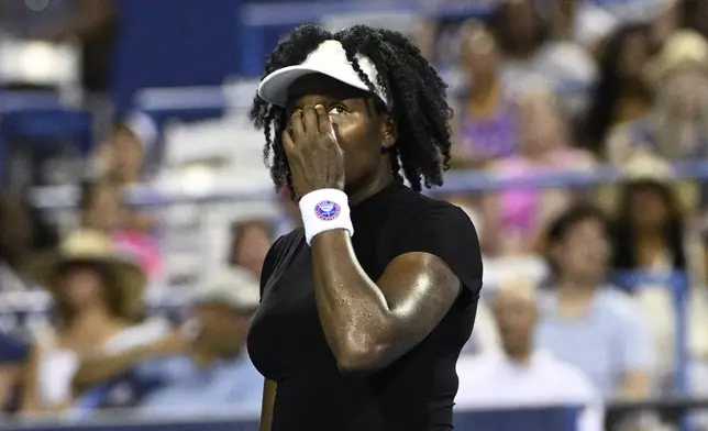 Venus Williams reacts during a match against Magdalena Frech, of Poland, at the Citi Open tennis tournament Thursday, July 24, 2025, in Washington. (AP Photo/Nick Wass)