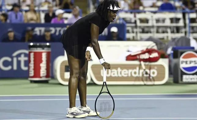 Venus Williams reacts during a match against Magdalena Frech, of Poland, at the Citi Open tennis tournament Thursday, July 24, 2025, in Washington. (AP Photo/Nick Wass)