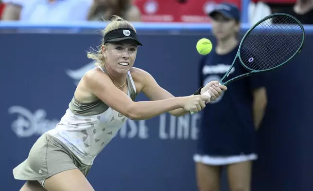 Magdalena Frech, of Poland, chases the ball against Venus Williams during a match at the Citi Open tennis tournament Thursday, July 24, 2025, in Washington. (AP Photo/Nick Wass)