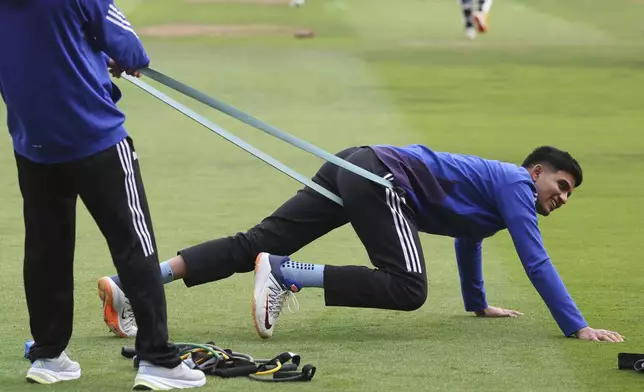 India's captain Shubman Gill performs stretching exercises before the start of play on day one of the second cricket test match between England and India at Edgbaston in Birmingham, England, Wednesday, July 2, 2025. (AP Photo/Scott Heppell)