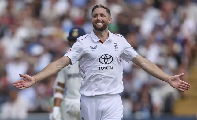 England's Chris Woakes celebrates the dismissal of India's KL Rahul on day one of the second cricket test match between England and India at Edgbaston in Birmingham, England, Wednesday, July 2, 2025. (AP Photo/Scott Heppell)