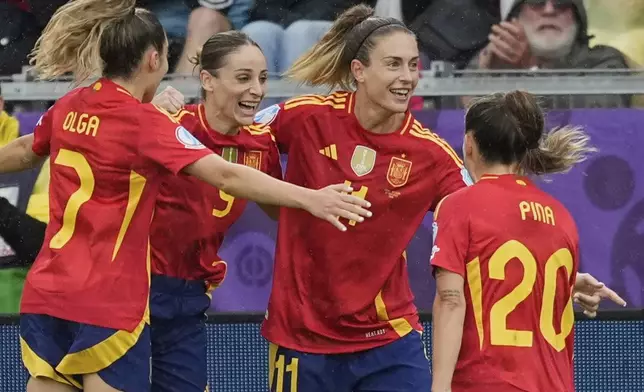 Spain's Alexia Putellas (11) celebrates after scoring her side's opening goal during the Euro 2025, group B, soccer match between Spain and Belgium at Arena Thun in Thun, Switzerland, Monday, July 7, 2025. (AP Photo/Martin Meissner)