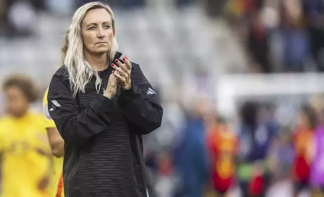 Belgium's head coach Elisabet Gunnarsdottir applauds after the UEFA Women's EURO 2025 Group B soccer match between Spain and Belgium at the Stockhorn Arena in Thun, Switzerland, Monday, July 7, 2025. (Til Buergy/Keystone via AP)