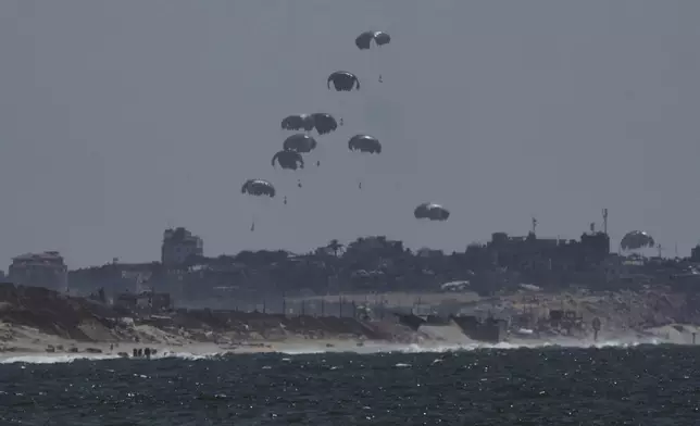 Humanitarian aid is airdropped to Palestinians over northern Gaza Strip, Thursday, July 31, 2025. (AP Photo/Jehad Alshrafi)