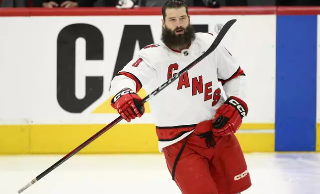 FILE - Carolina Hurricanes defenseman Brent Burns (8) warms up before Game 5 of a second-round NHL hockey playoff series against the Washington Capitals Thursday, May 15, 2025, in Washington. (AP Photo/Nick Wass, File)
