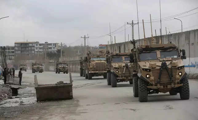 FILE - This March 25, 2020 file photo shows British troops with NATO-led Resolute Support Mission forces in Kabul, Afghanistan. (AP Photo/Rahmat Gul, file)