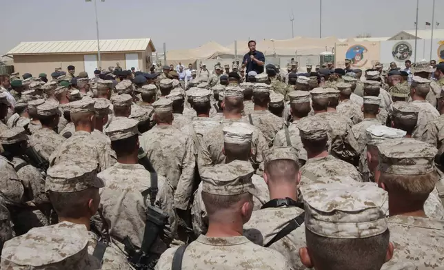 FILE - Britain's Prime Minister David Cameron delivers a speech to British and US troops during a visit to Camp Bastion, outside Lashkar Gah, the provincial capital of Helmand province in south Afghanistan, July 4, 2011. (AP Photo/Lefteris Pitarakis, pool, file)