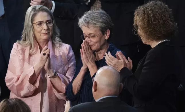 FILE - Leah Goldin, whose son Hadar was killed in the Gaza war in 2014, reacts as she is acknowledged by Israeli President Isaac Herzog during his speech to a joint session of Congress, Wednesday, July 19, 2023, at the Capitol in Washington, accompanied by Israeli first lady Michal Herzog, left. (AP Photo/Jacquelyn Martin, File)