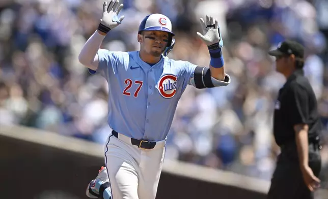 Chicago Cubs' Seiya Suzuki celebrates while rounding the bases after hitting a three-run home run during the first inning of a baseball game against the Boston Red Sox, Friday, July 18, 2025, in Chicago. (AP Photo/Paul Beaty)