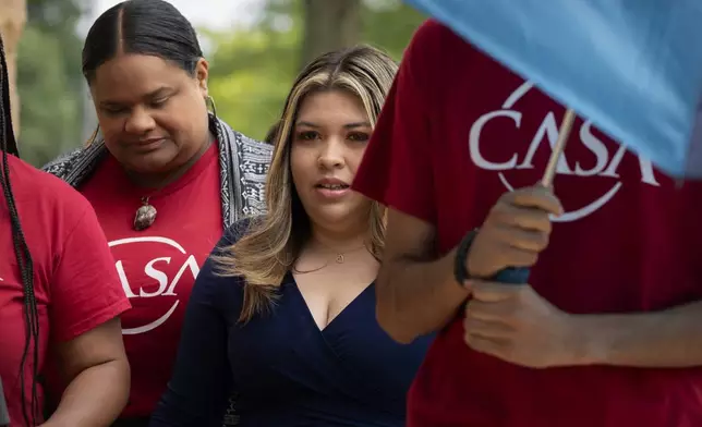 Jennifer Vasquez Sura, center, the wife of Kilmar Abrego Garcia, arrives at the U.S. District Court in Greenbelt, Md., Monday, July 7, 2025. (AP Photo/Mark Schiefelbein)