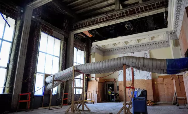 Original detail work along the ceiling is visible in the main two-story board room as renovations continue on the Federal Reserve, Thursday, July 24, 2025, in Washington. (Andrew Harnik/Pool Photo via AP)