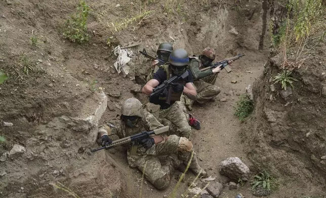 Ukrainian 3rd Assault Brigade recruits train at the polygon in Kyiv region, Ukraine, on Wednesday, July 16, 2025. (AP Photo/Evgeniy Maloletka)