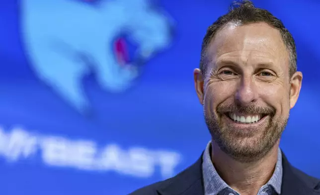 Jeffrey Housenbold, CEO and president of MrBeast, poses for a picture during a Nasdaq closing bell ceremony Wednesday, July 23, 2025, in New York's Times Square. (AP Photo/Stefan Jeremiah)