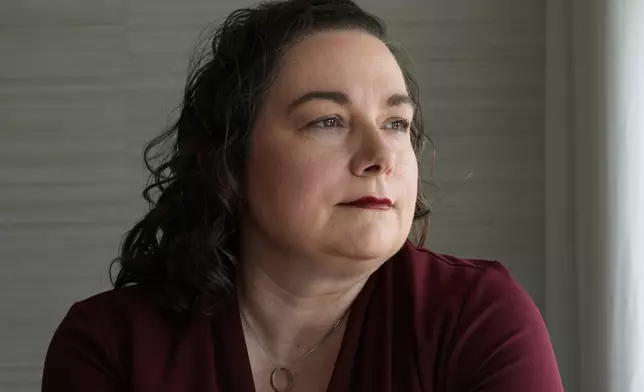 Brandy Ellis, who had electrodes installed in her brain and pacemaker-like device installed in her chest as part of an experimental treatment for depression, sits at her home Thursday, July 24, 2025, in Delray Beach, Fla. (AP Photo/Marta Lavandier)
