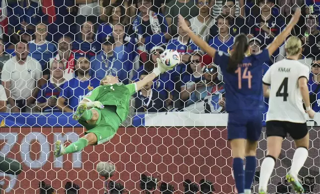 Germany goalkeeper Ann-Katrin Berger makes a save during the Women's Euro 2025 quarterfinals soccer match between France and Germany at St. Jakob-Park in Basel, Switzerland, Saturday, July 19, 2025. (AP Photo/Alessandra Tarantino)