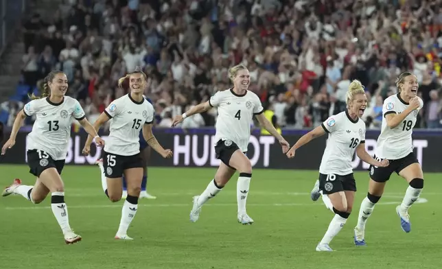 Players of Germany run to celebrate after winning the Women's Euro 2025 quarterfinals soccer match between France and Germany at St. Jakob-Park in Basel, Switzerland, Saturday, July 19, 2025. (AP Photo/Martin Meissner)