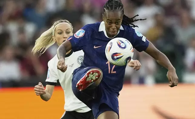 Germany's Kathrin Hendrich, left, challenges France's Marie-Antoinette Katoto during the Women's Euro 2025 quarterfinals soccer match between France and Germany at St. Jakob-Park in Basel, Switzerland, Saturday, July 19, 2025. (AP Photo/Martin Meissner)