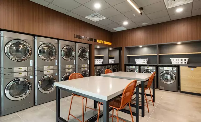 Guest laundry facility at LivSmart Studios by Hilton Tullahoma. The hotel is the first for LivSmart Studios, a new extended-stay brand that blends the comfort and functionality of studio apartment-style accommodations with the consistency, value and hospitality travelers expect when they stay with Hilton. (Photo: Hilton)