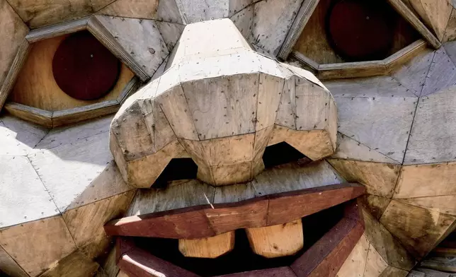 The face of a giant troll sculpture created by the Danish recycle artist Thomas Dambo and his team that's part of an installation of six sculptures called "Trolls Save the Humans" is seen on display at the historic estate Filoli, Saturday, July 5, 2025, in Woodside, Calif. (AP Photo/Terry Chea)